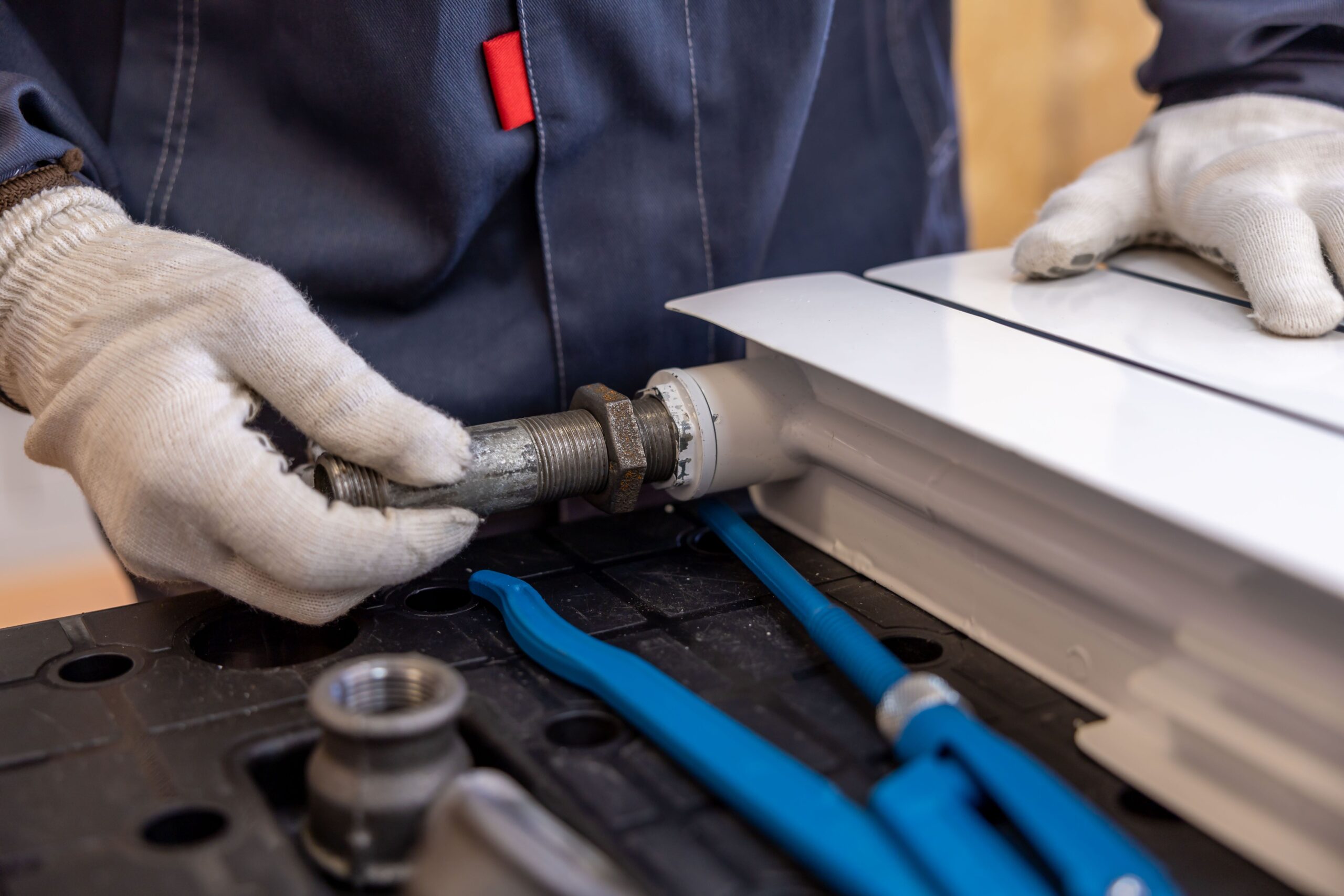 Plumbing service technician preparing a service request visit